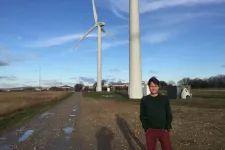 man and windmills